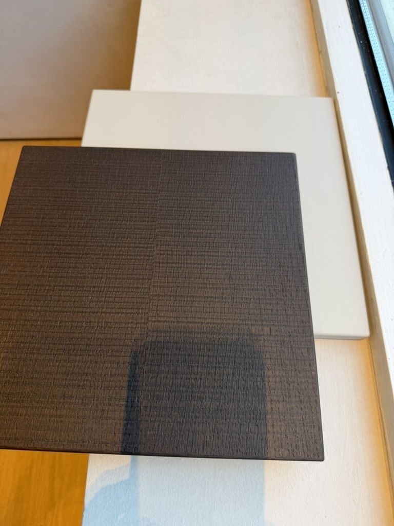 Dark ribbed wood and white lacquer finish samples