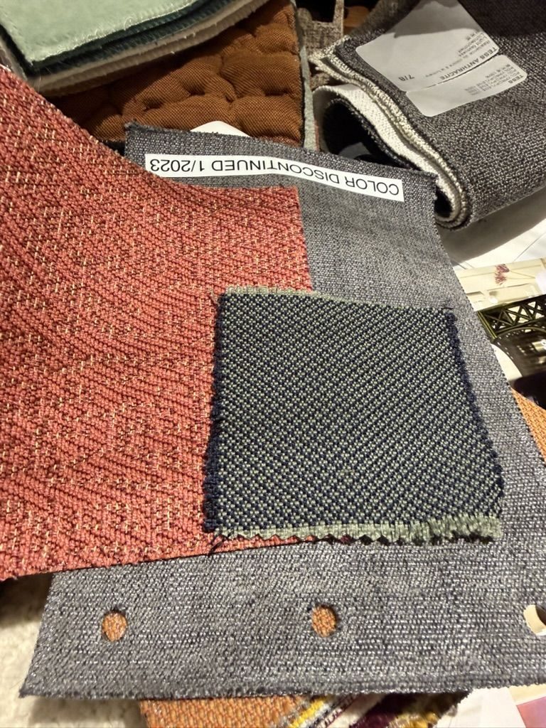 Coral, slate and navy upholstery samples