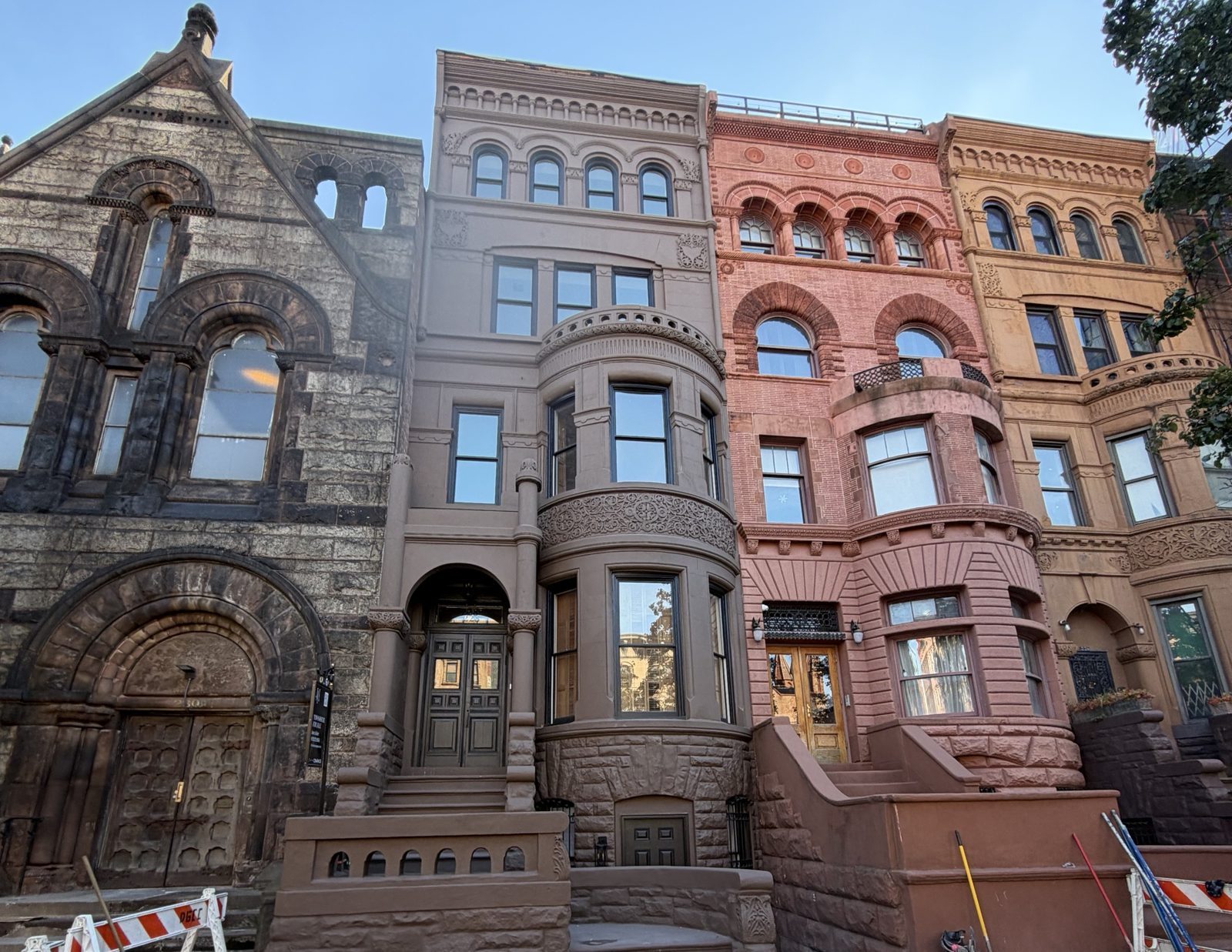 A restored Romanesque Revival townhouse in a Harlem row