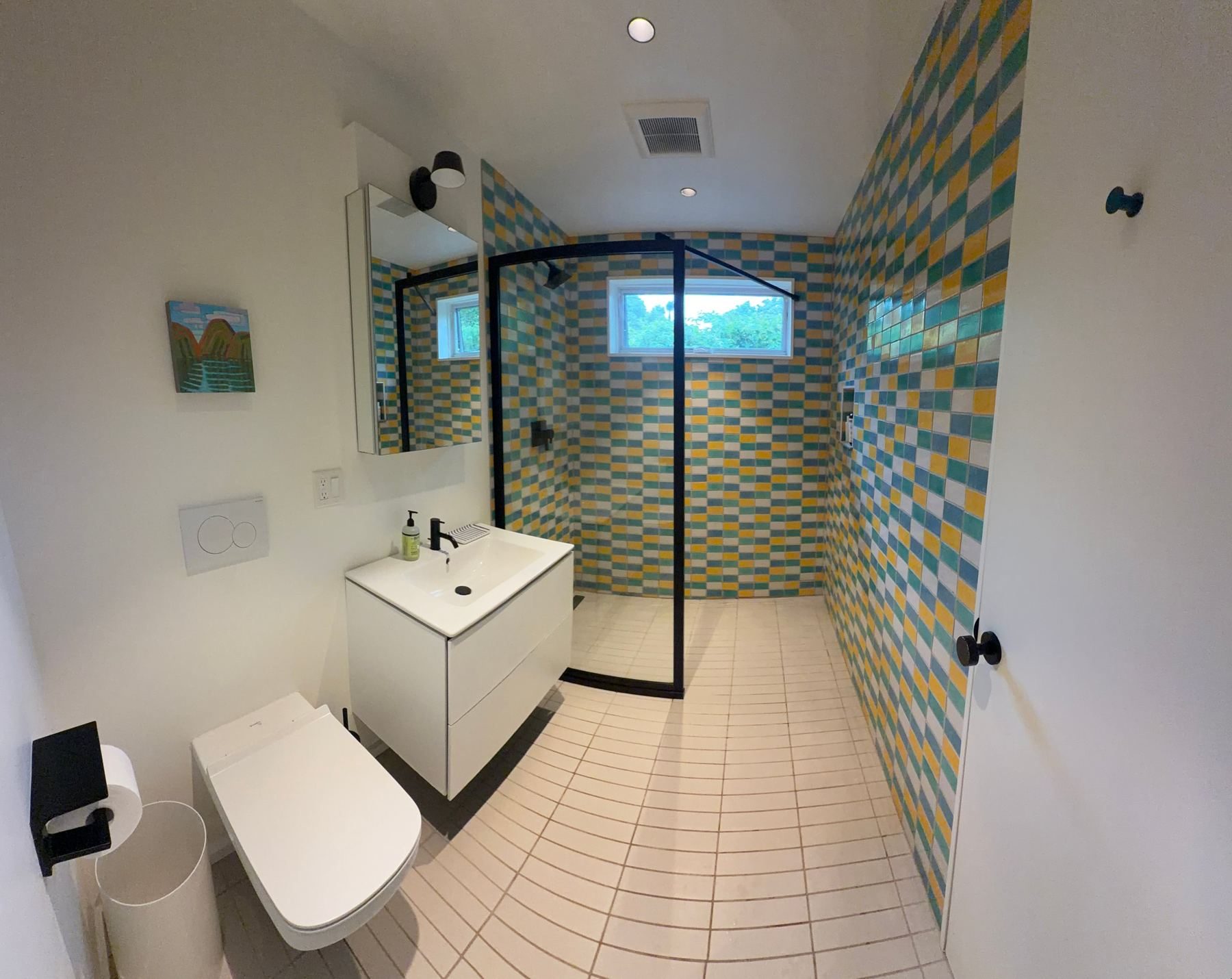 Bathroom with yellow and teal tile