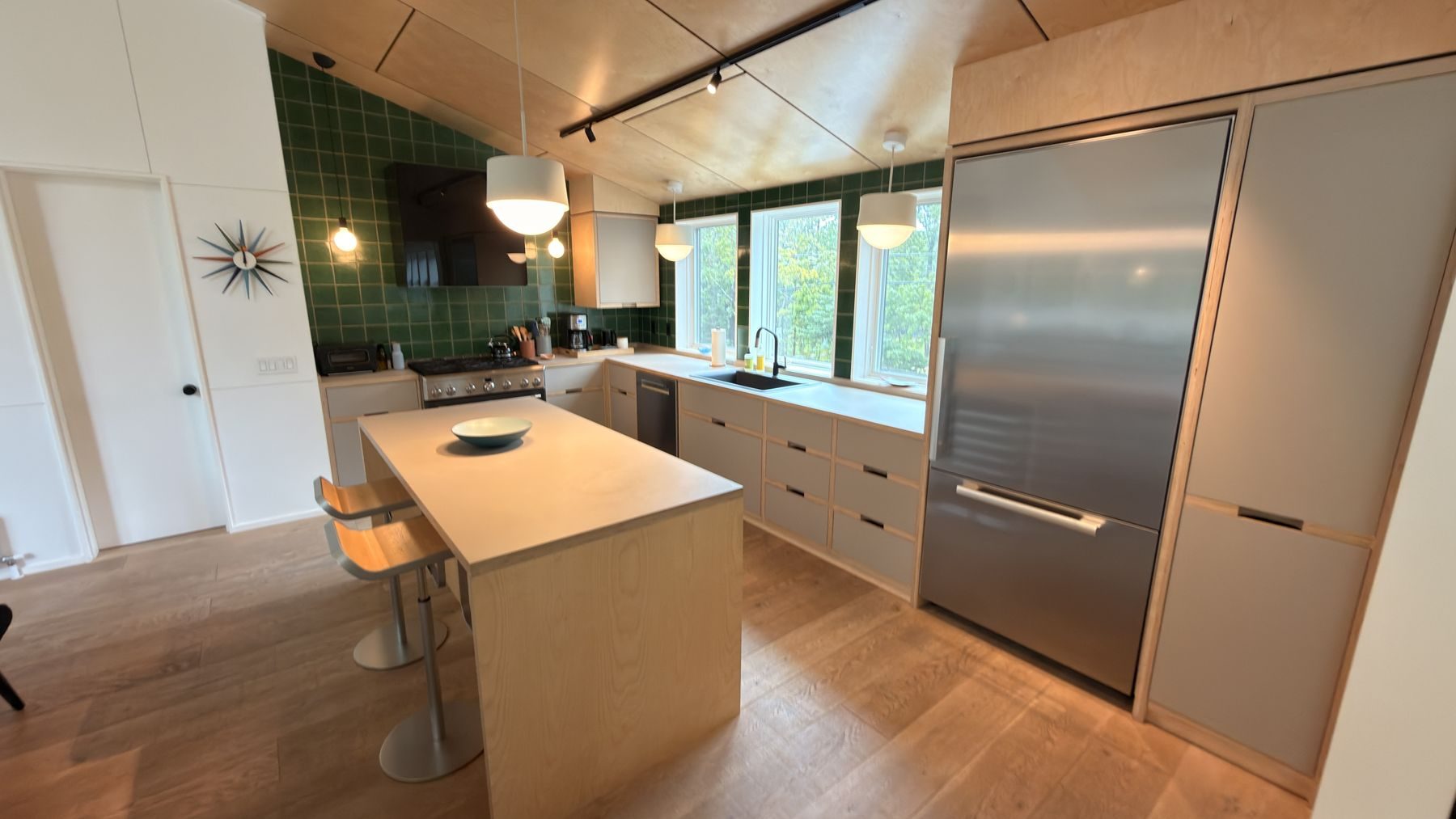 The Garage kitchen with green tile