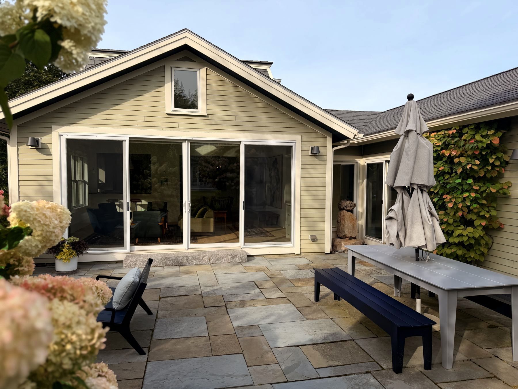 Glass doors onto the stone patio