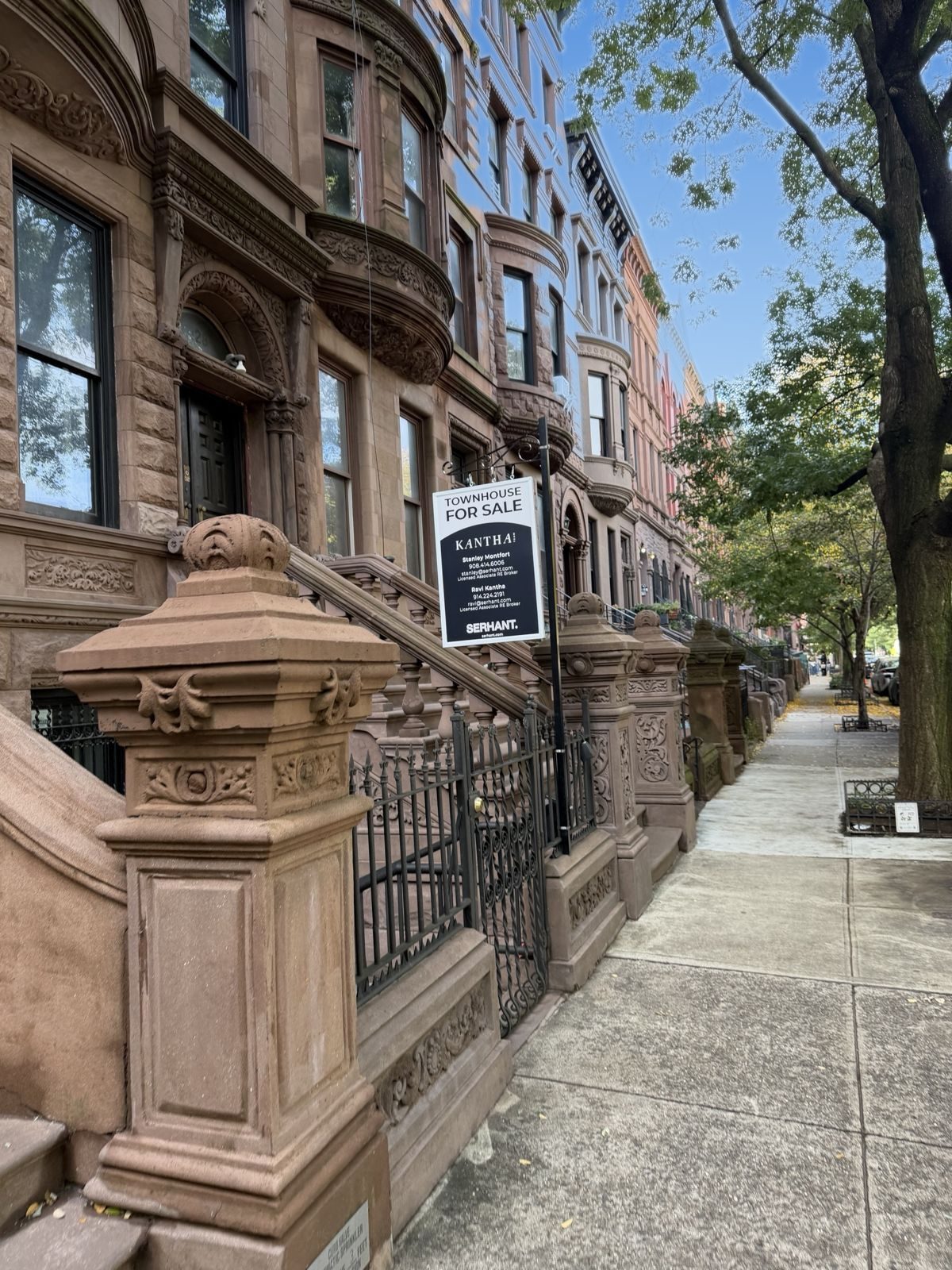 The Elevator House stoop and newel posts along the tree-lined block