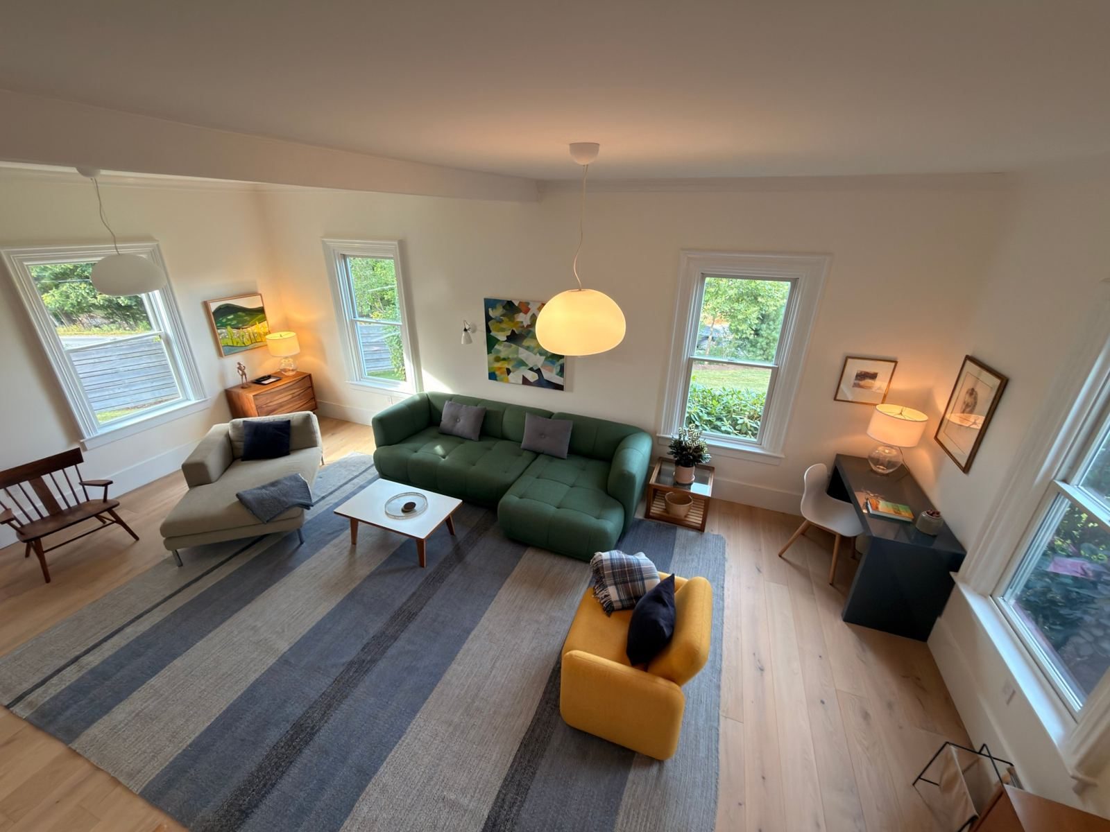 Sitting room with green sofa and yellow chair