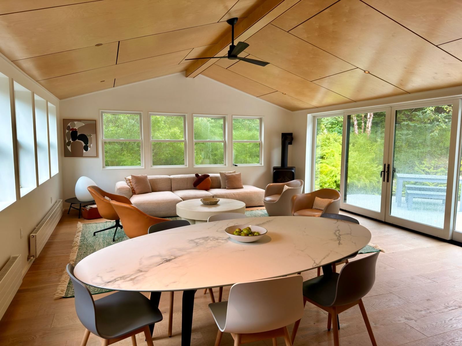 Marble dining table and lounge under the birch ceiling