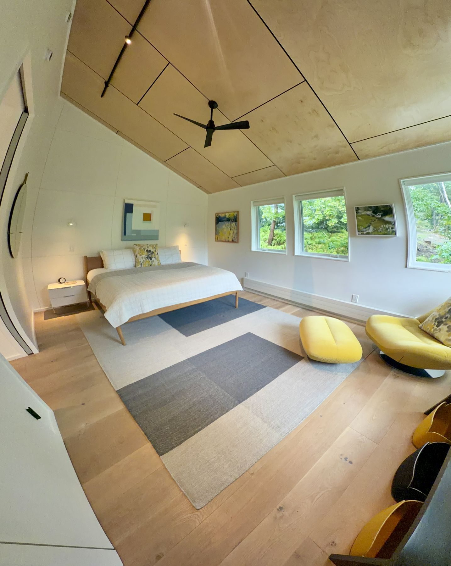 The Garage bedroom under a birch ceiling