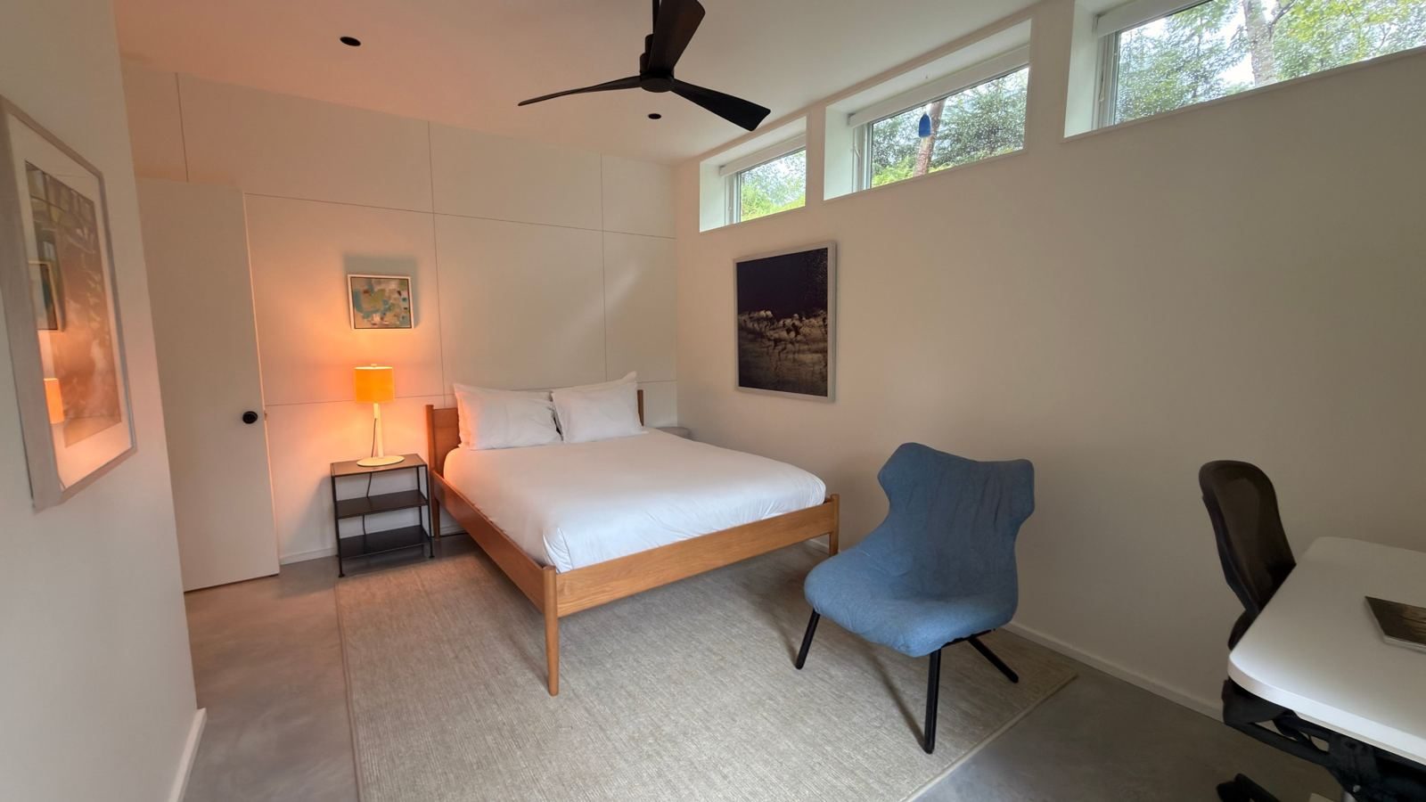Bedroom with clerestory windows and desk