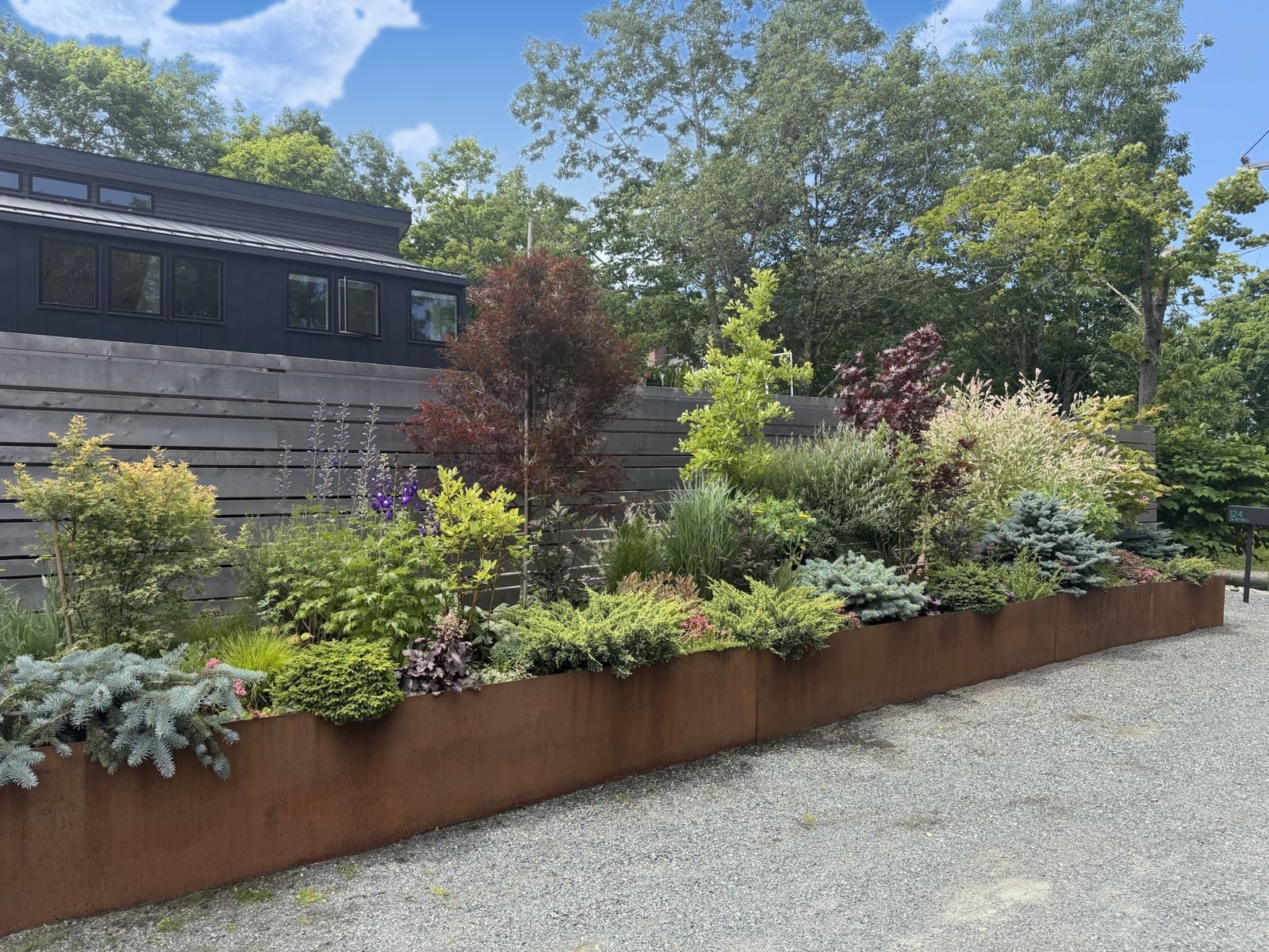Corten-steel garden bed at the entrance